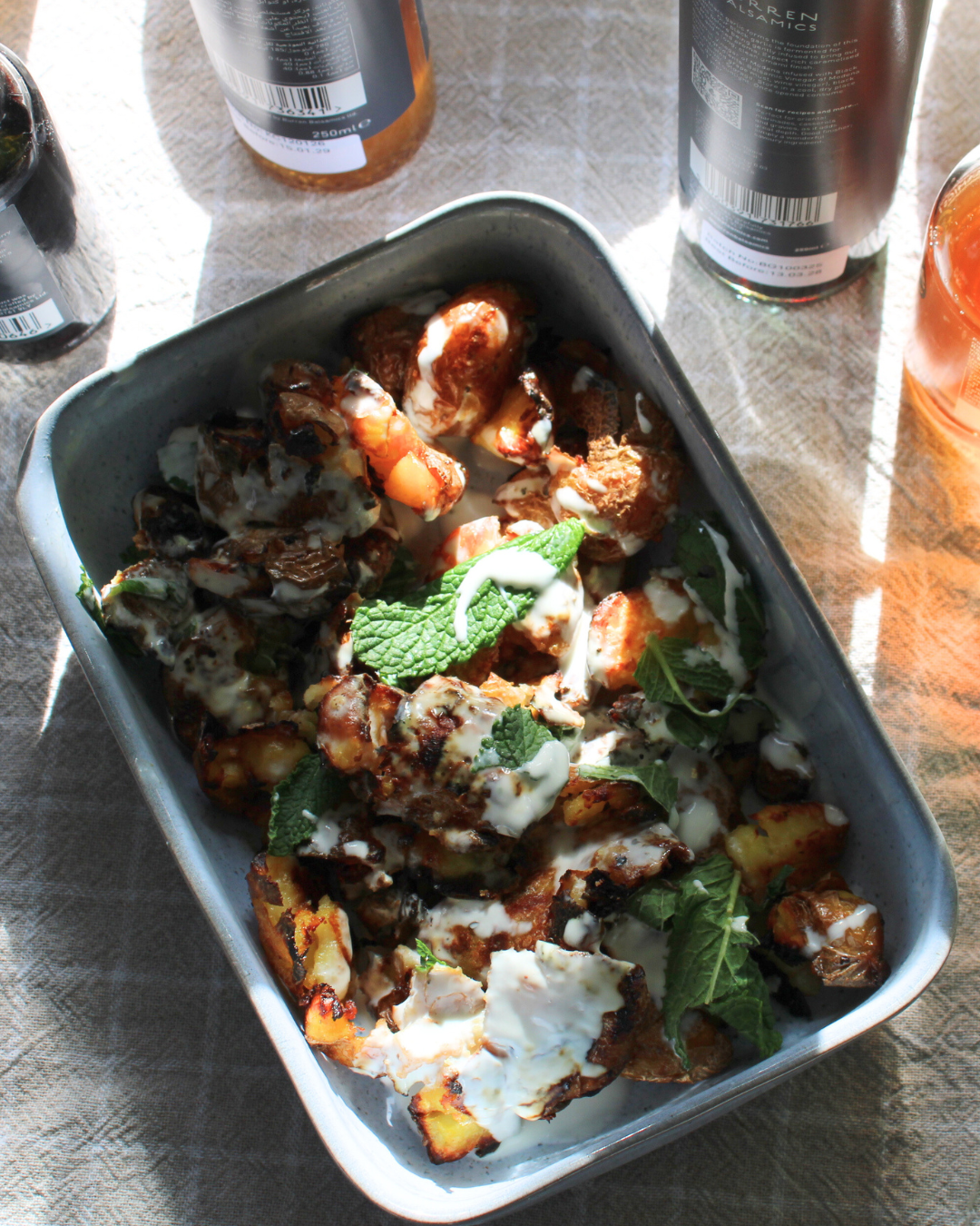 Crispy Baby Balsamic Potatoes with mayo and mint dressing.